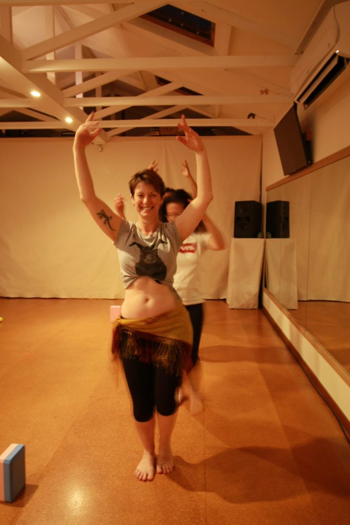 Smiling ladies in belly dance class